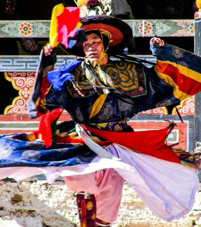 Colorfully dressed Bhutan man dances at festival