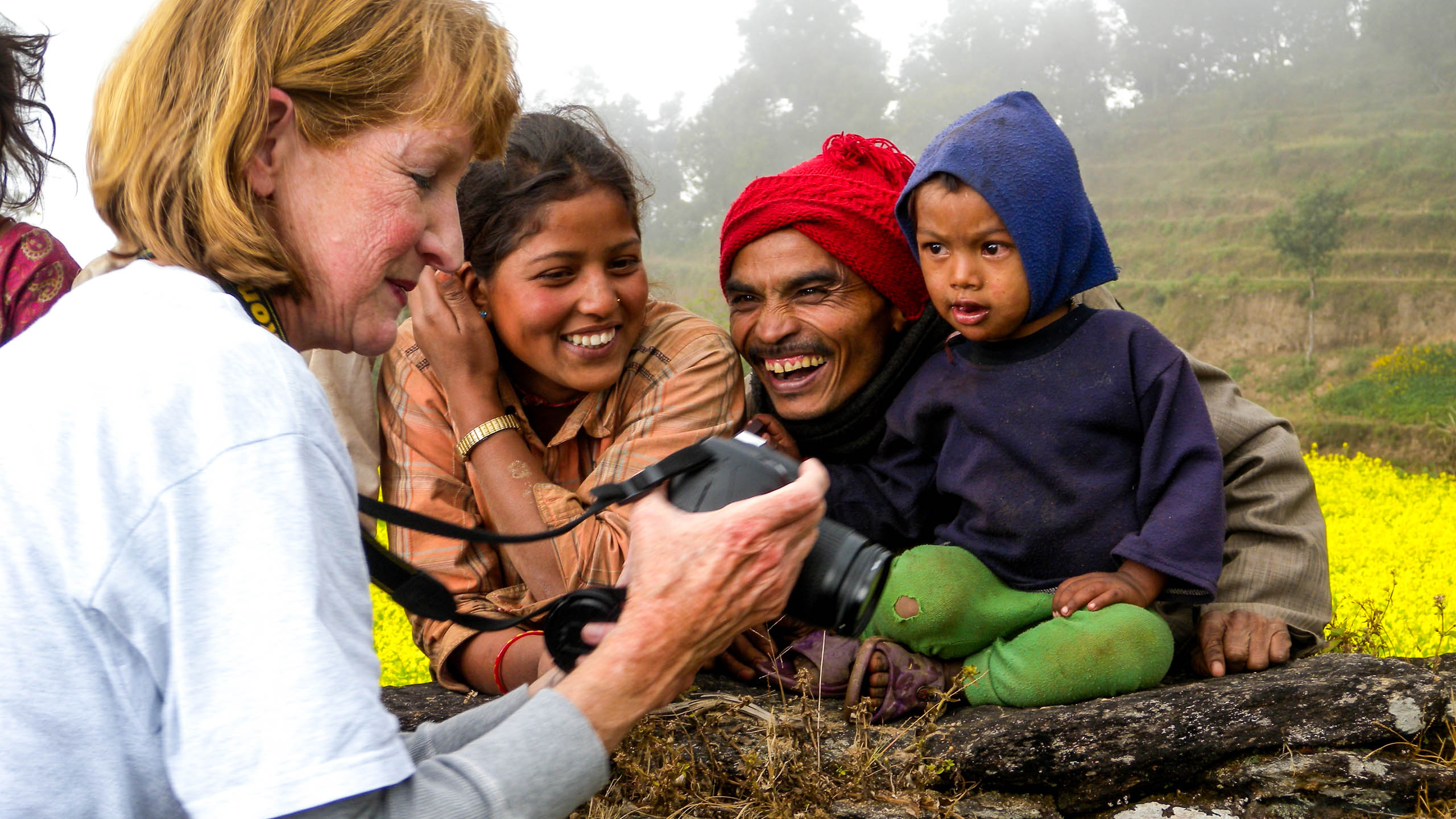 Woman shares digital photos with Nepal family